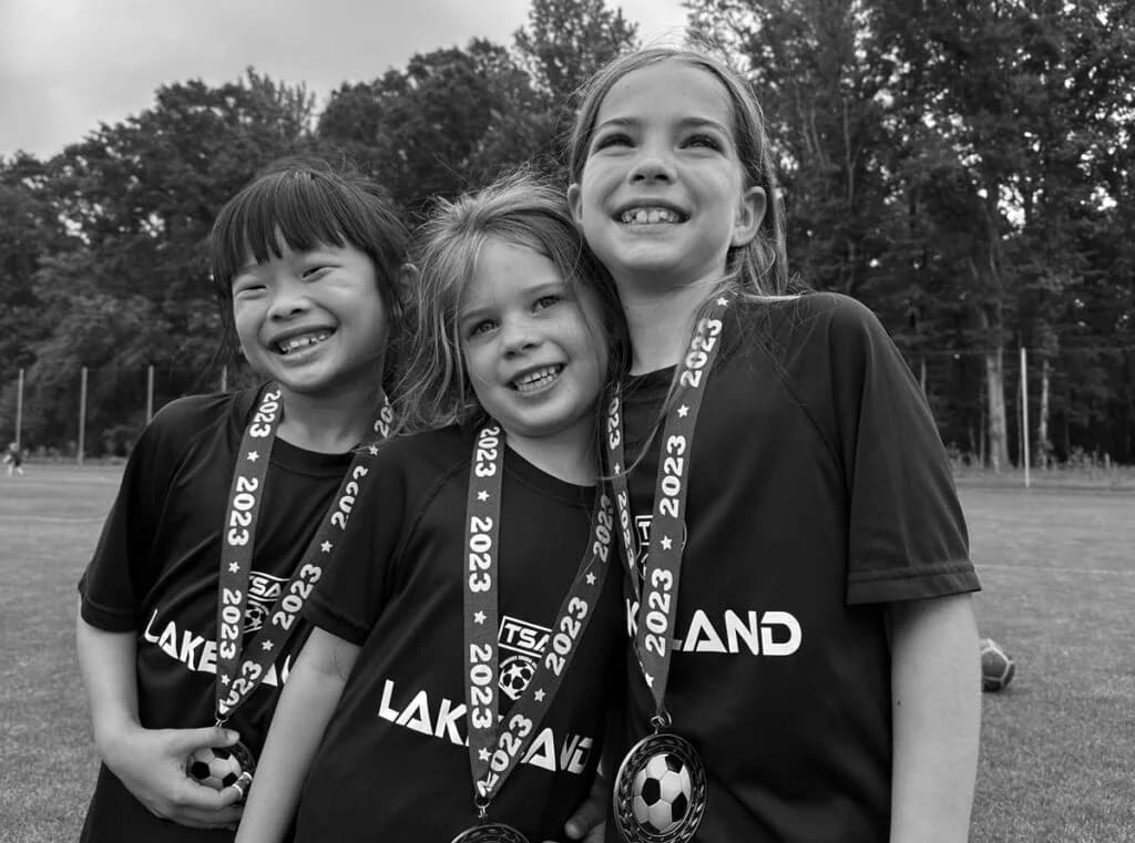 TSA players celebrating with their medals